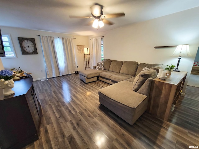 214 W 12th St, Flora, IL 62839 - living room featuring a ceiling fan, dark wood-style flooring, and baseboards
