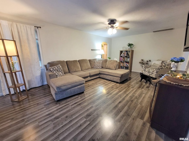 214 W 12th St, Flora, IL 62839 - living area with a ceiling fan and dark wood-style flooring
