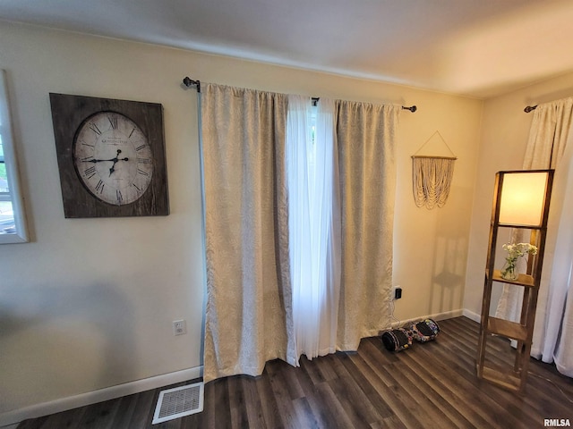 214 W 12th St, Flora, IL 62839 - interior space with dark wood finished floors and baseboards