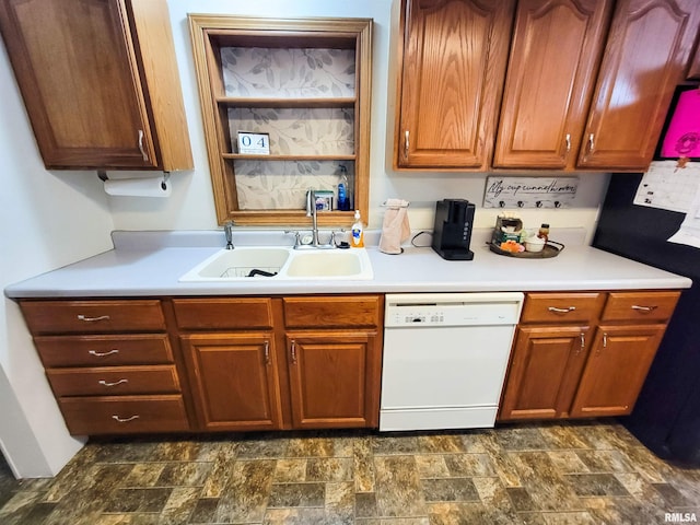 214 W 12th St, Flora, IL 62839 - kitchen with white dishwasher, a sink, stone finish floors, and light countertops