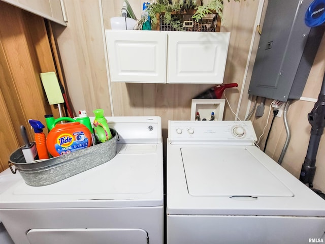 214 W 12th St, Flora, IL 62839 - washroom with electric panel, cabinet space, and washing machine and clothes dryer