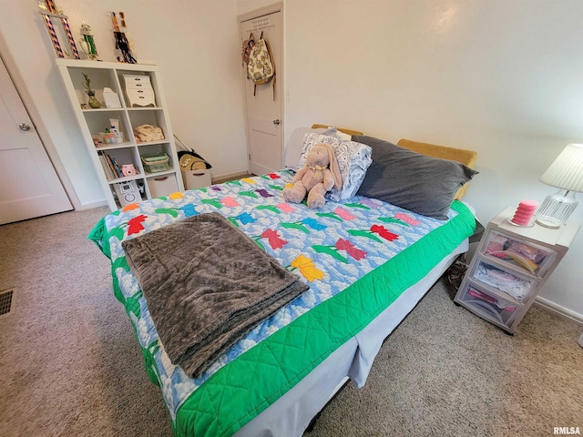 214 W 12th St, Flora, IL 62839 - carpeted bedroom featuring baseboards