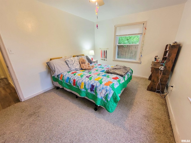 214 W 12th St, Flora, IL 62839 - carpeted bedroom featuring baseboards and a ceiling fan