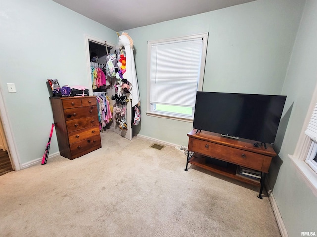 214 W 12th St, Flora, IL 62839 - carpeted bedroom with baseboards, a spacious closet, and a closet