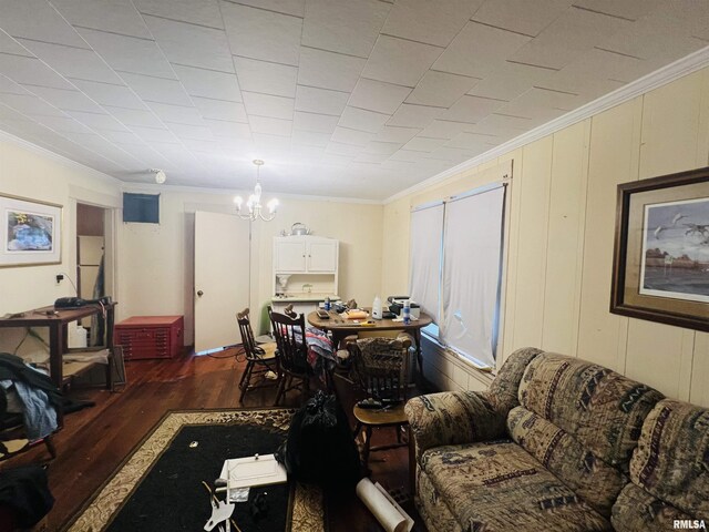 1508 Fisk St, Eldorado, IL 62930 - living room featuring ornamental molding, dark wood-style floors, and a chandelier