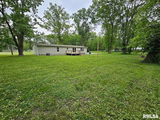 901 W 4th St, Bluford, IL 62814 - view of green lawn with a wooden deck