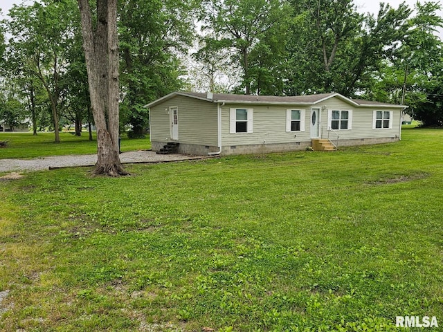 901 W 4th St, Bluford, IL 62814 - back of house featuring crawl space, entry steps, a yard, and view of wooded area