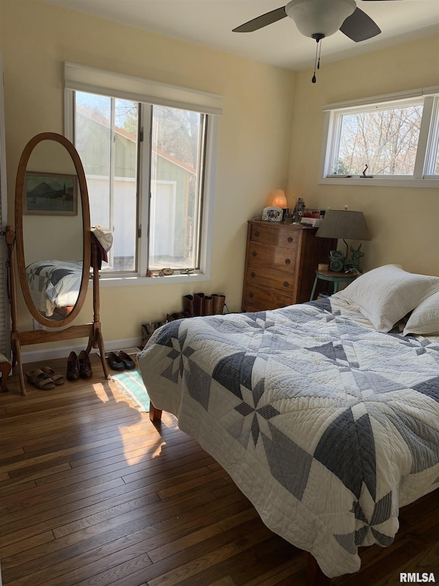 bedroom featuring hardwood / wood-style floors and a ceiling fan