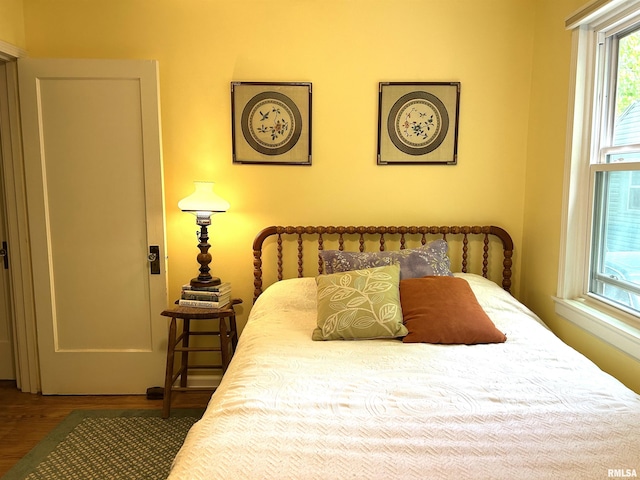 bedroom with wood finished floors