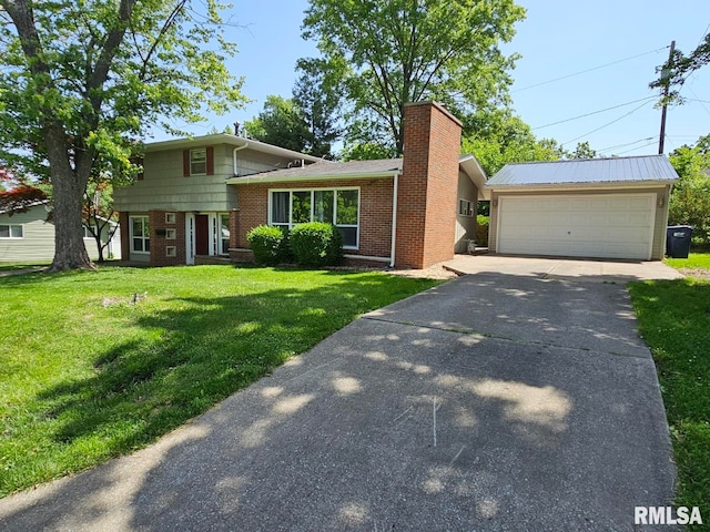 2 Parker Dr, Mount Vernon, IL 62864 - split level home featuring brick siding, a front lawn, a chimney, and a detached garage