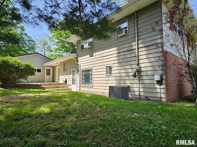 2 Parker Dr, Mount Vernon, IL 62864 - back of property with central AC unit and a lawn