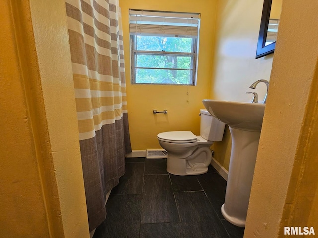 2 Parker Dr, Mount Vernon, IL 62864 - bathroom with toilet, baseboards, and curtained shower
