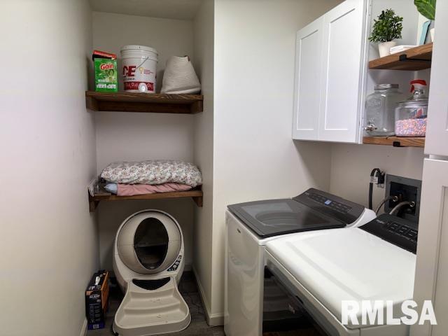 1500 Saint Andrews Pl, Herrin, IL 62948 - clothes washing area with washer and clothes dryer, cabinet space, and baseboards
