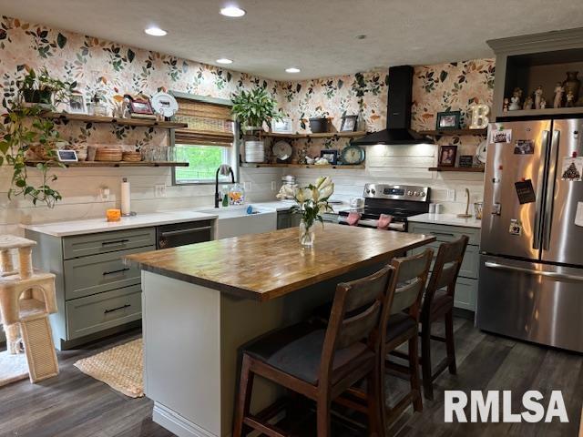 1500 Saint Andrews Pl, Herrin, IL 62948 - kitchen with stainless steel appliances, open shelves, exhaust hood, wood counters, and recessed lighting