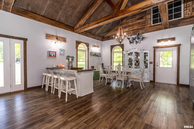 540 Kendall Ln, Marion, IL 62959 - dining space featuring high vaulted ceiling, dark wood-style flooring, healthy amount of natural light, a chandelier, and baseboards