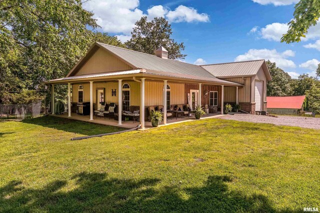540 Kendall Ln, Marion, IL 62959 - rear view of property with a chimney, a lawn, metal roof, and a patio area