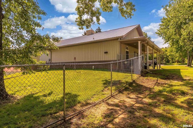540 Kendall Ln, Marion, IL 62959 - view of property exterior featuring metal roof and a chimney