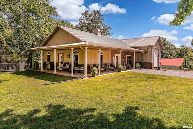 540 Kendall Ln, Marion, IL 62959 - rear view of property with a chimney, a lawn, metal roof, and a patio area