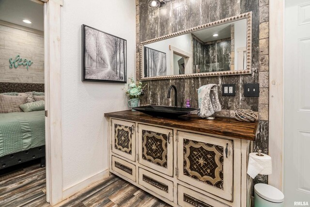 540 Kendall Ln, Marion, IL 62959 - bathroom view of vanity, wood finished floors, tasteful backsplash, and baseboards