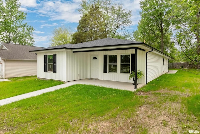 308 Prentice Ave, Carterville, IL 62918 - view of front of house featuring a patio area and roof with shingles