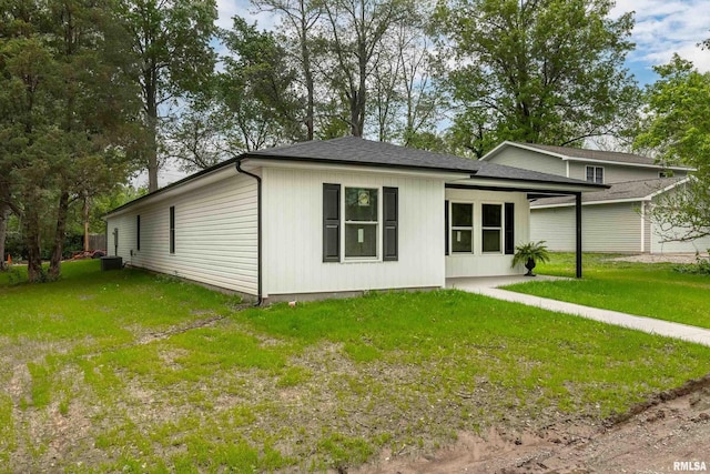 308 Prentice Ave, Carterville, IL 62918 - view of front of home featuring a front lawn and roof with shingles