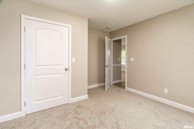 308 Prentice Ave, Carterville, IL 62918 - unfurnished bedroom featuring carpet floors and baseboards