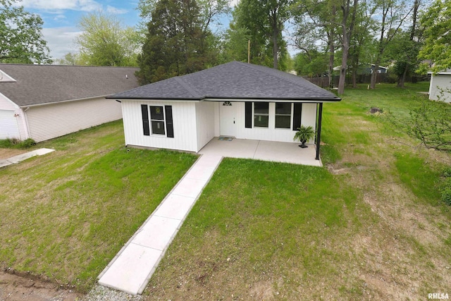 308 Prentice Ave, Carterville, IL 62918 - view of front of house with a patio, a shingled roof, and a front yard