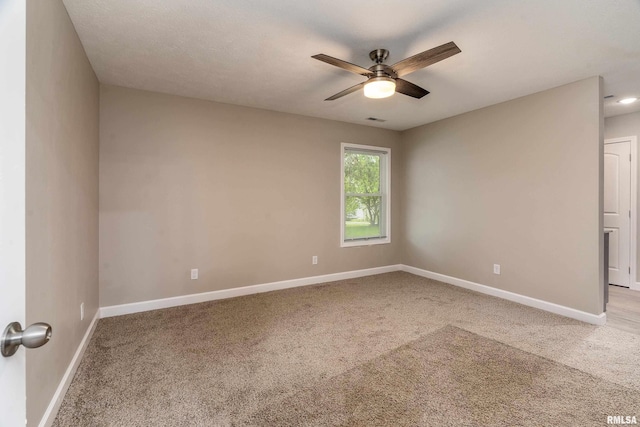 308 Prentice Ave, Carterville, IL 62918 - spare room featuring carpet flooring, ceiling fan, and baseboards