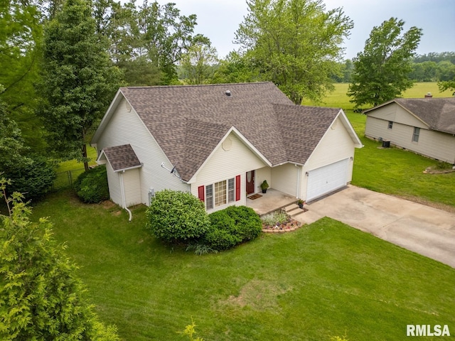 1021 Meadowlark Dr, Carterville, IL 62918 - traditional-style home with a shingled roof, driveway, and an attached garage