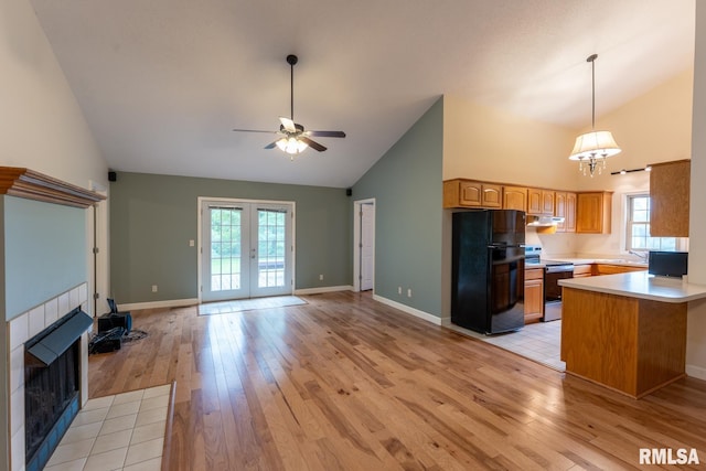 1021 Meadowlark Dr, Carterville, IL 62918 - kitchen featuring freestanding refrigerator, range with electric stovetop, high vaulted ceiling, open floor plan, and ceiling fan