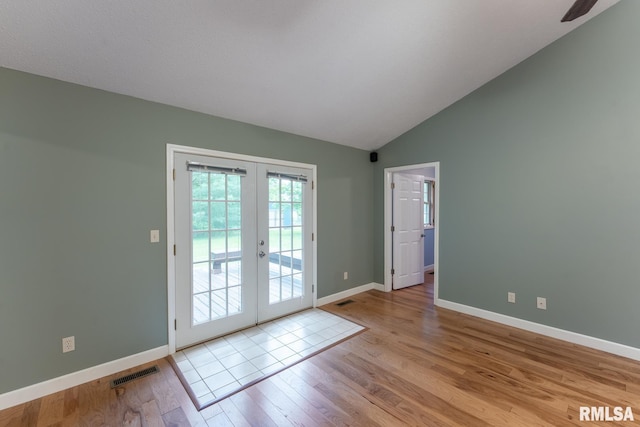 1021 Meadowlark Dr, Carterville, IL 62918 - doorway with french doors, light wood-style floors, baseboards, and lofted ceiling