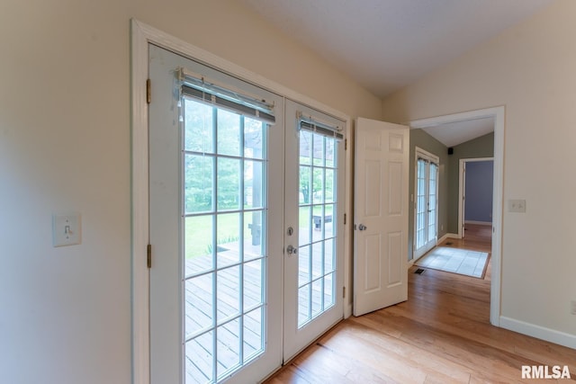 1021 Meadowlark Dr, Carterville, IL 62918 - entryway featuring vaulted ceiling, french doors, light wood-type flooring, and baseboards