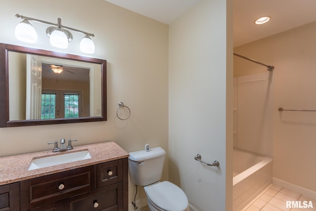 1021 Meadowlark Dr, Carterville, IL 62918 - full bath with toilet, tile patterned floors, vanity, baseboards, and bathtub / shower combination