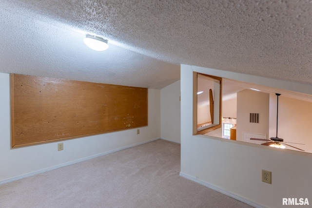 1021 Meadowlark Dr, Carterville, IL 62918 - additional living space featuring lofted ceiling, a textured ceiling, carpet, and a ceiling fan