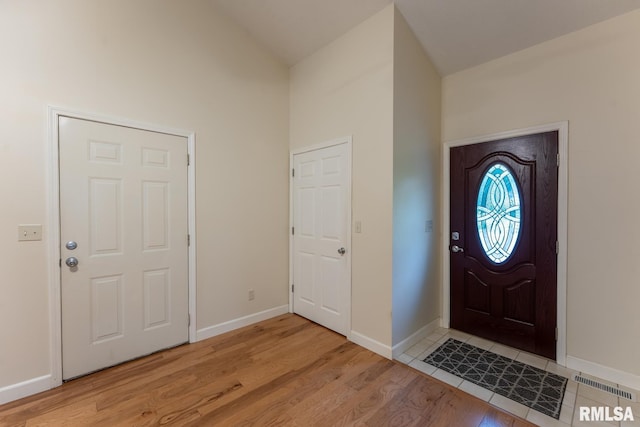 1021 Meadowlark Dr, Carterville, IL 62918 - foyer entrance featuring light wood-style flooring, baseboards, and high vaulted ceiling