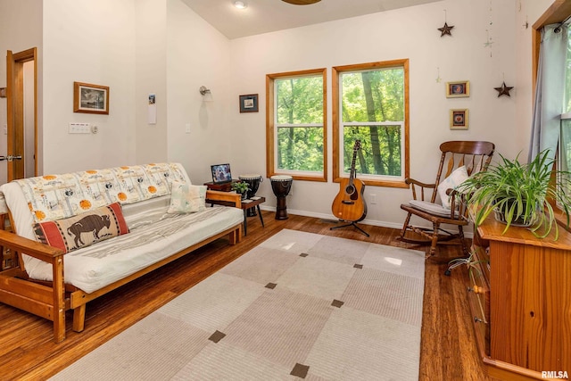 living room with wood finished floors and baseboards