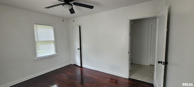 2814 Mannen St, Mount Vernon, IL 62864 - unfurnished bedroom featuring wood finished floors, baseboards, ceiling fan, and a closet