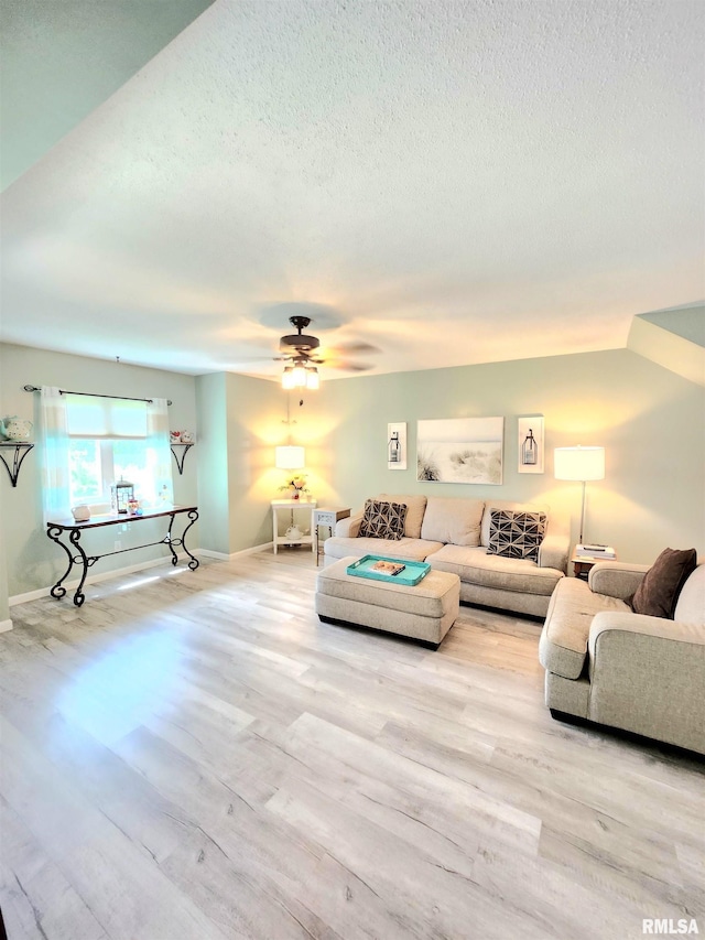 1144 S Morningside Dr, Carbondale, IL 62901 - living room with wood finished floors, a textured ceiling, a ceiling fan, and baseboards