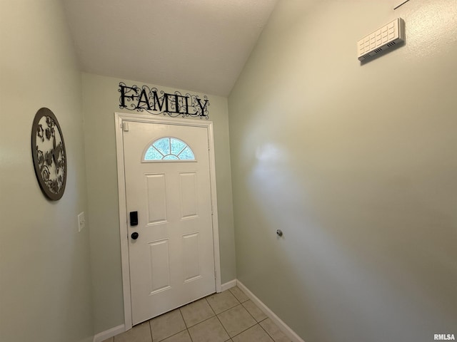 1144 S Morningside Dr, Carbondale, IL 62901 - foyer entrance with baseboards, light tile patterned flooring, and vaulted ceiling