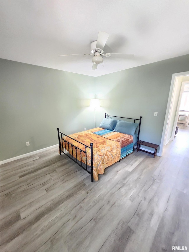 1144 S Morningside Dr, Carbondale, IL 62901 - bedroom featuring wood finished floors, baseboards, and a ceiling fan