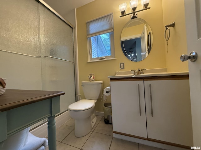 1144 S Morningside Dr, Carbondale, IL 62901 - full bathroom with toilet, tile patterned floors, a shower with door, and vanity