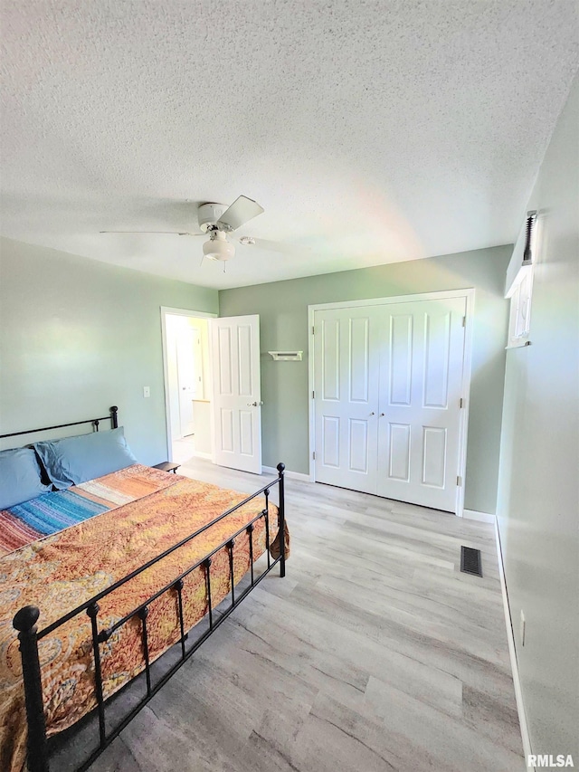 1144 S Morningside Dr, Carbondale, IL 62901 - bedroom featuring a textured ceiling, wood finished floors, baseboards, and a ceiling fan