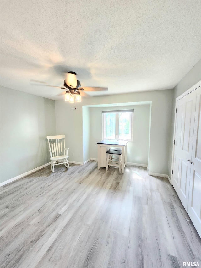 1144 S Morningside Dr, Carbondale, IL 62901 - interior space with a textured ceiling, wood finished floors, ceiling fan, and baseboards