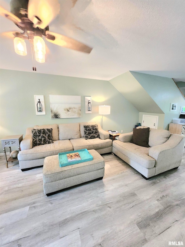 1144 S Morningside Dr, Carbondale, IL 62901 - living area with wood finished floors, a ceiling fan, lofted ceiling, and a textured ceiling