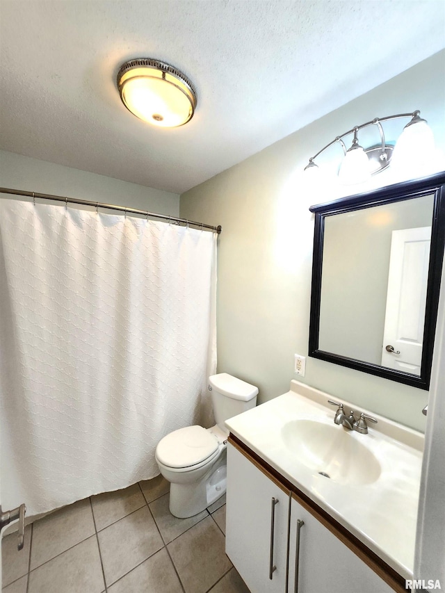 1144 S Morningside Dr, Carbondale, IL 62901 - full bath featuring tile patterned floors, toilet, and vanity