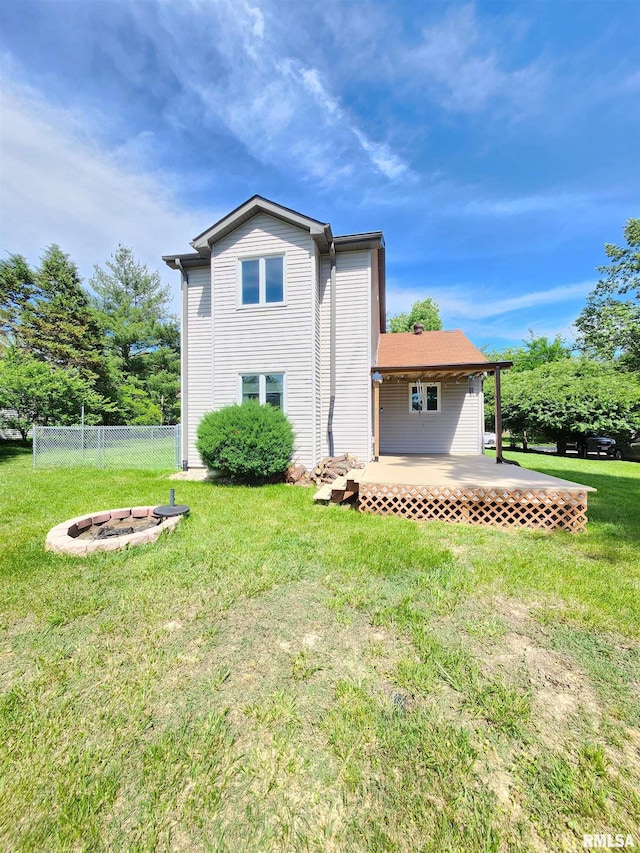 1144 S Morningside Dr, Carbondale, IL 62901 - back of property with a fire pit and a deck