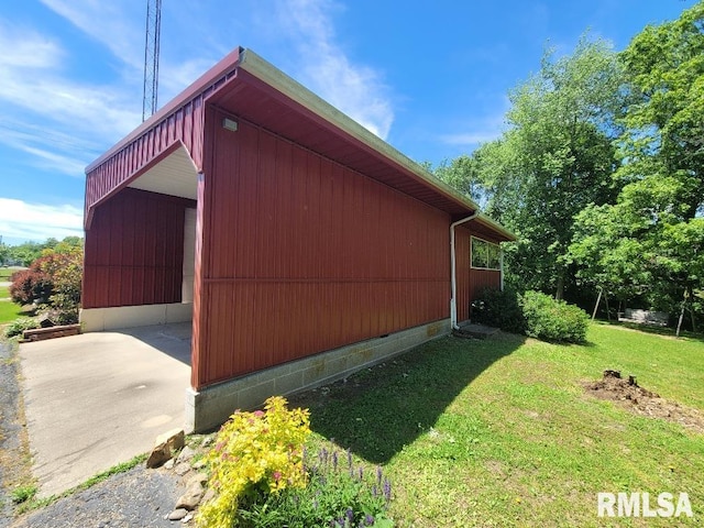 view of property exterior with a yard