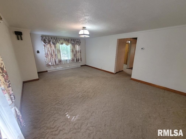 carpeted spare room featuring baseboard heating, a textured ceiling, crown molding, and baseboards