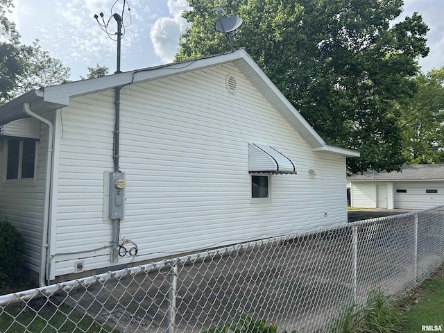 401 W 11th St, Christopher, IL 62822 - view of side of property featuring a detached garage