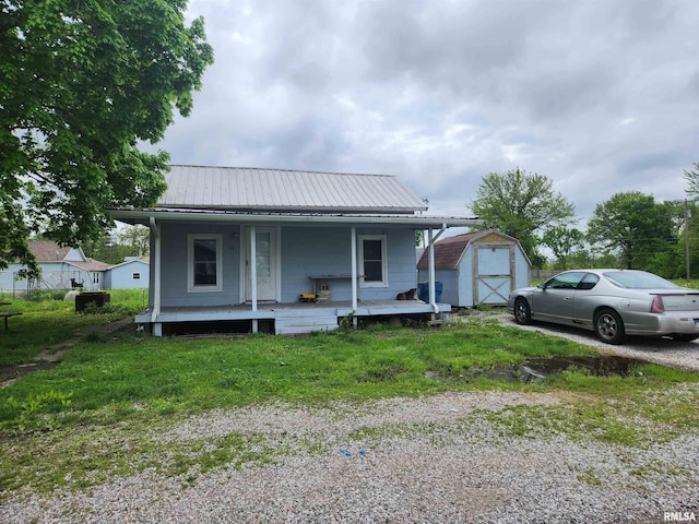 42 S 2nd St, Ashley, IL 62808 - view of front of home with a porch and metal roof